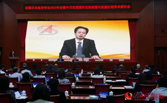 中國社會科學院副院長王昌林發表視頻致辭。人民網記者 陳建軍攝